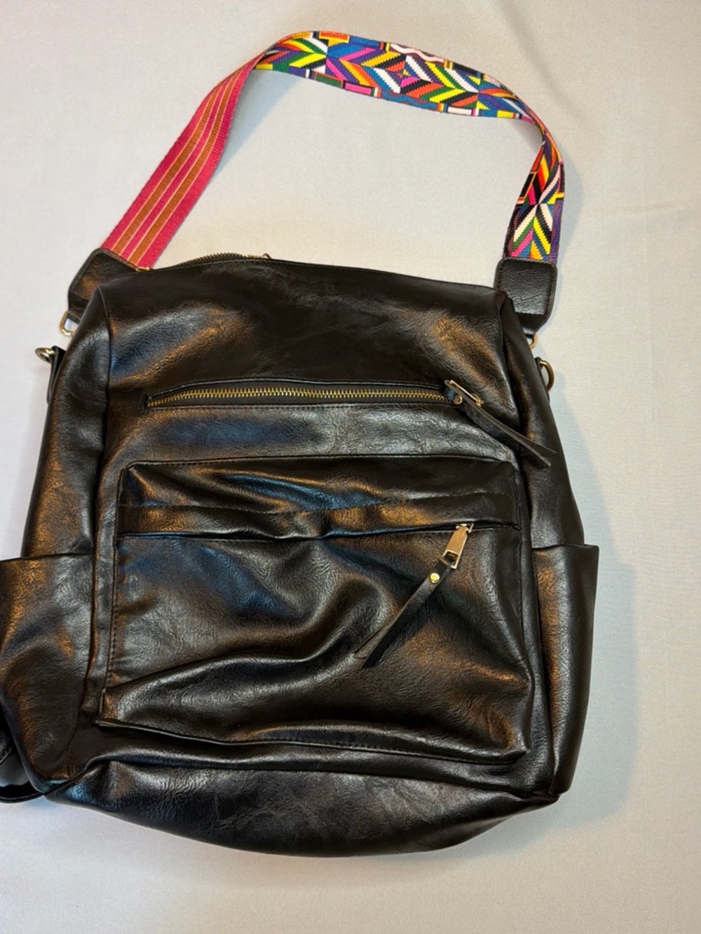Source Unknown Black Vegan Leather Backpack with Multicolor Geometric Strap